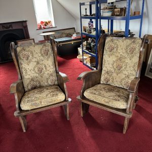 Pair of antique Elm Lambing Chairs with floral upholstery